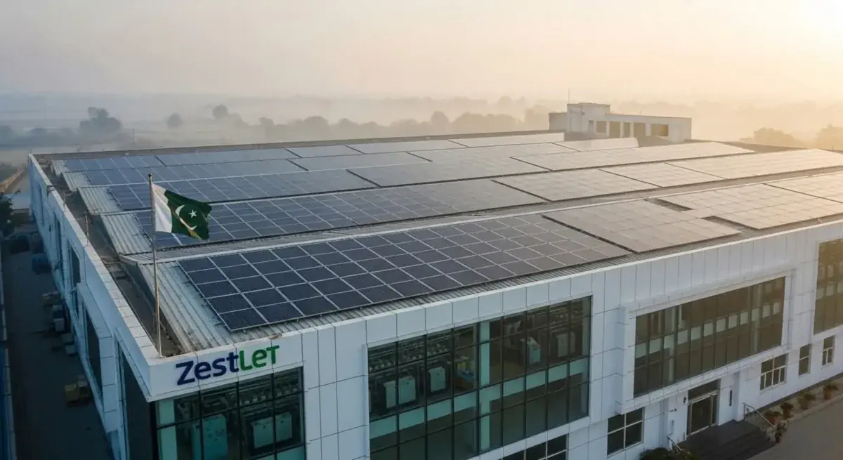 ZESTLET Building with Rooftop Solar Panels A building marked Zestlet with rooftop solar panels and a Pakistan flag.