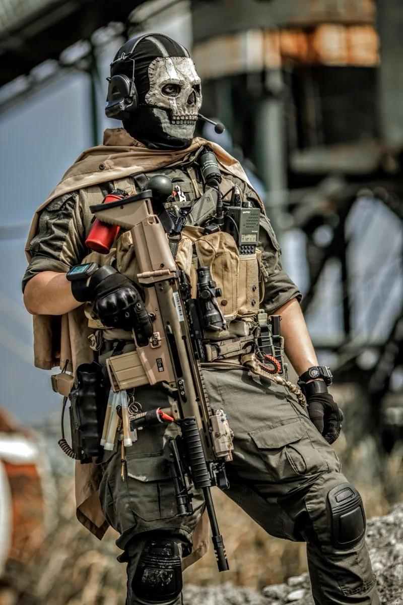 Tactical Clothing and Load-Bearing Gear Reference | ZESTLET A person wearing olive tactical clothing, a tan equipment vest, gloves and knee protection.